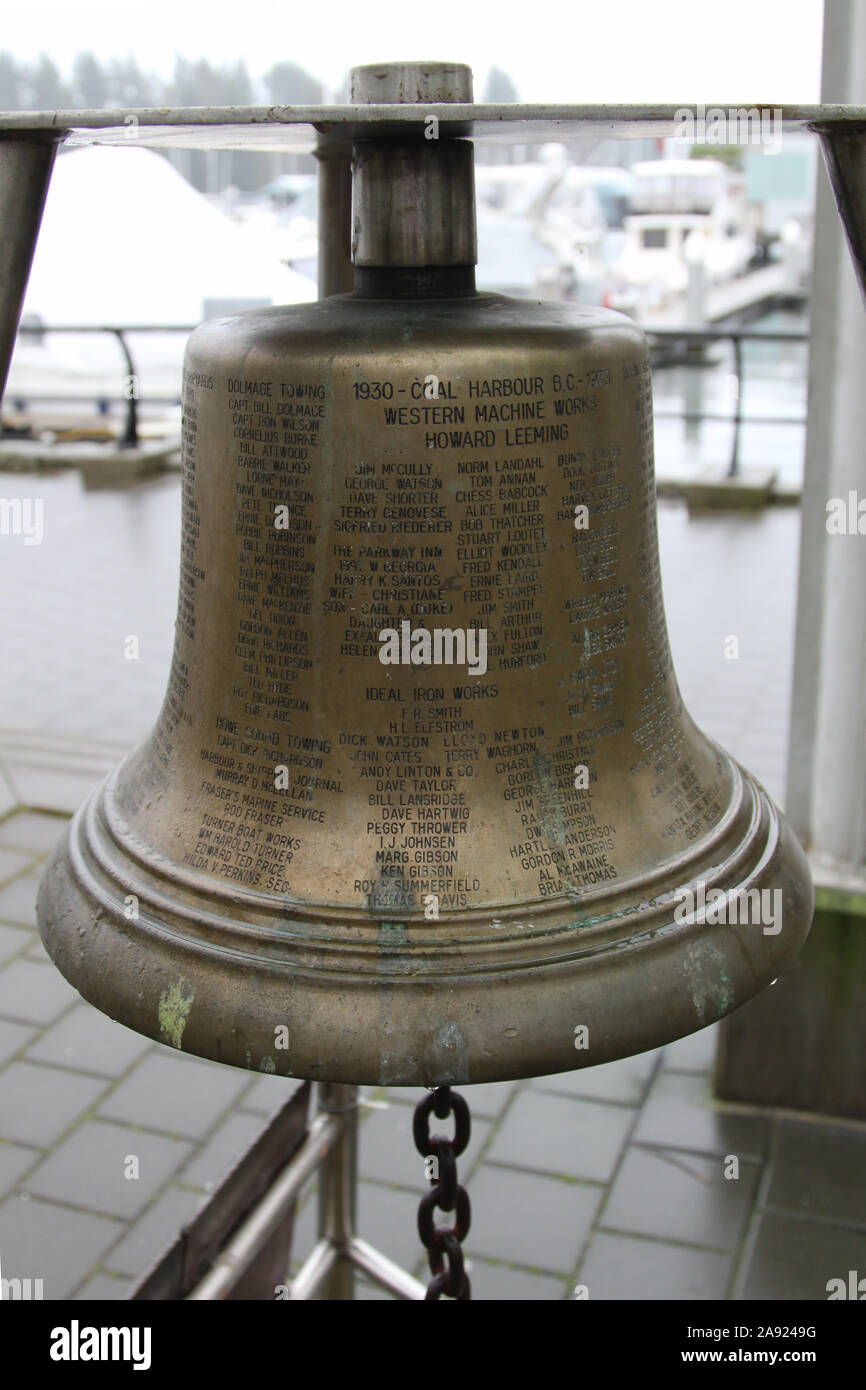 The Coal Harbour Fellowship Bell - Vancouver, BC, Canada. The bell is used as a remembrance of Coal Harbor and those who gave cause to be remembered Stock Photo