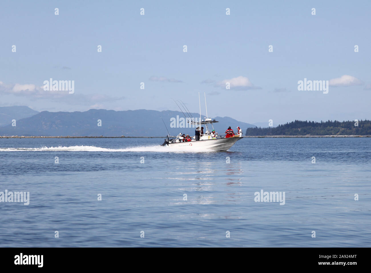 A Boston Whaler pleasure fishing boat 'West Coast Girl' speeds along the Campbell River, Vancouver, British Columbia, Canada, 2016 with copy space Stock Photo