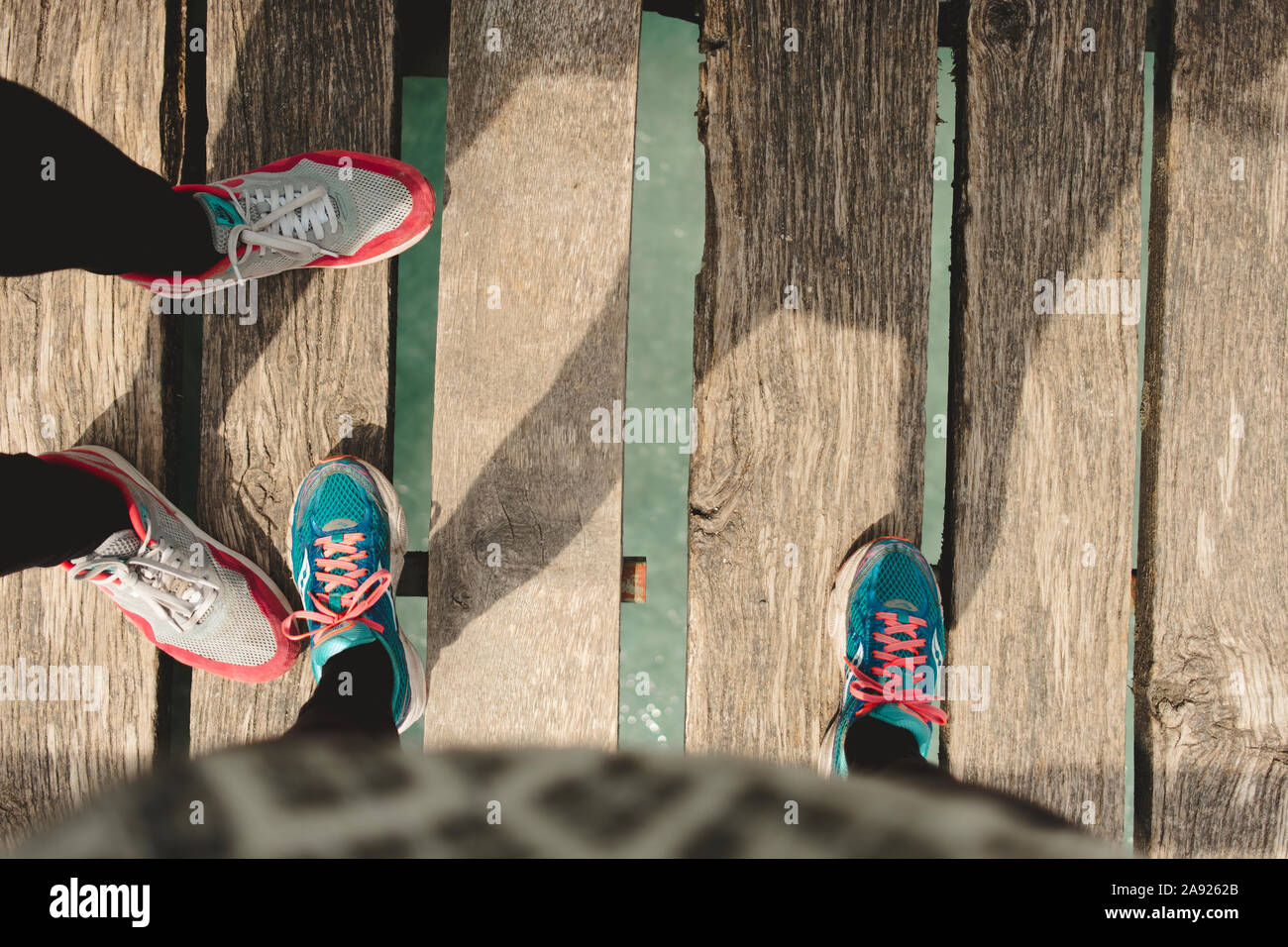 Women on jetty Stock Photo - Alamy