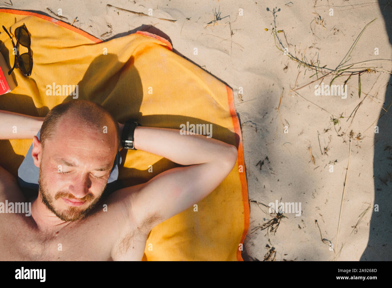 Man sunbathing Stock Photo