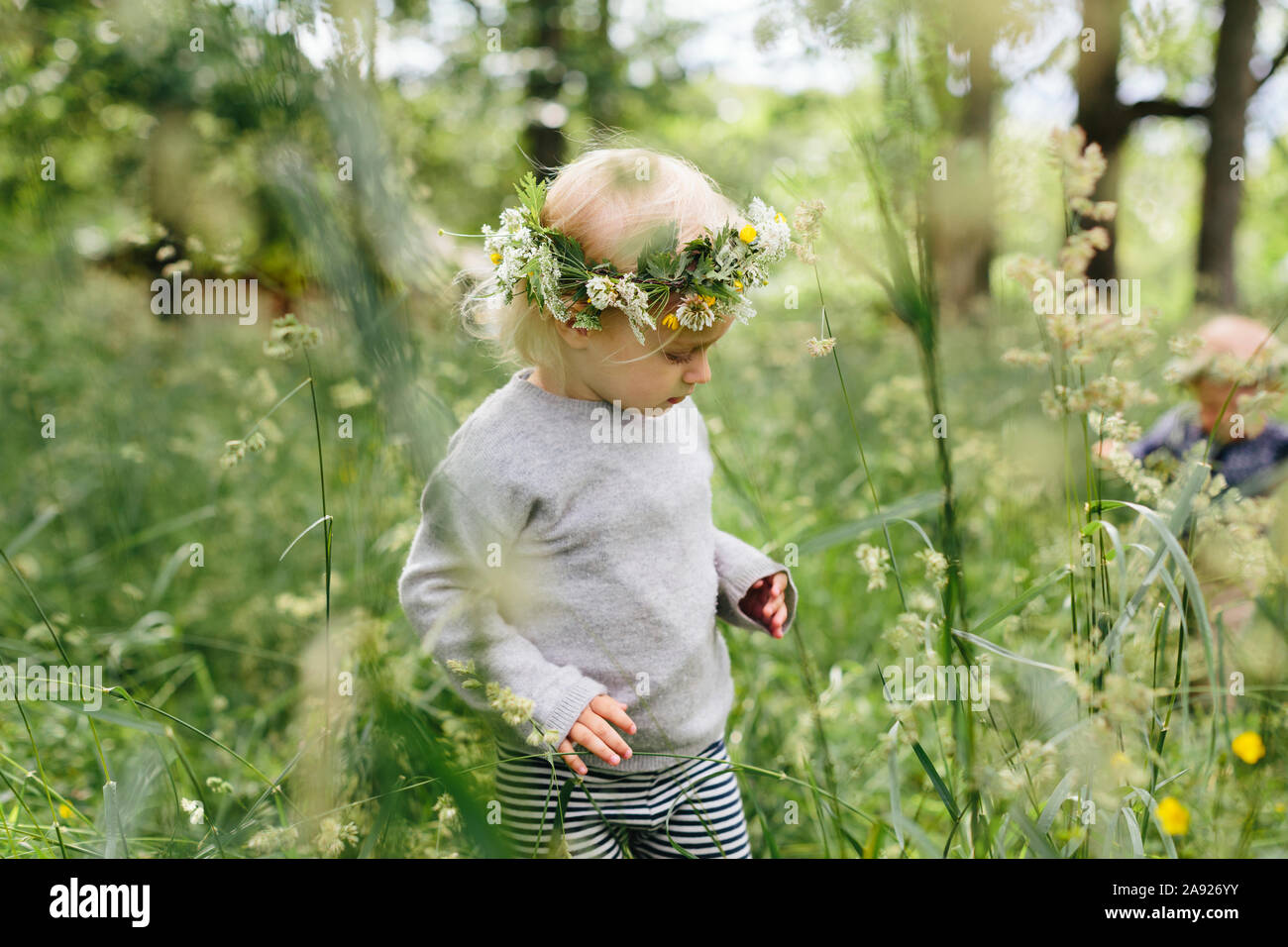 Girl wearing flower wreath Stock Photo - Alamy