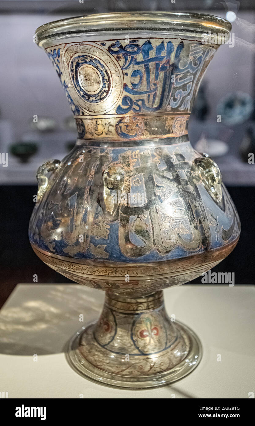 Italy Piedmont Turin - Mazzonis Palace - Mao Museum ( Museo d'Arte Orientale ) - Museum of Oriental art -  Mosque lamp  - Egypt - Mamluk Dynasty - Mid-14th century -  The Inscription on the neck of the lamp states ' Allah is the light of the heavens and heart. His Light is like that of a niche where a lamp is found [...]' Stock Photo