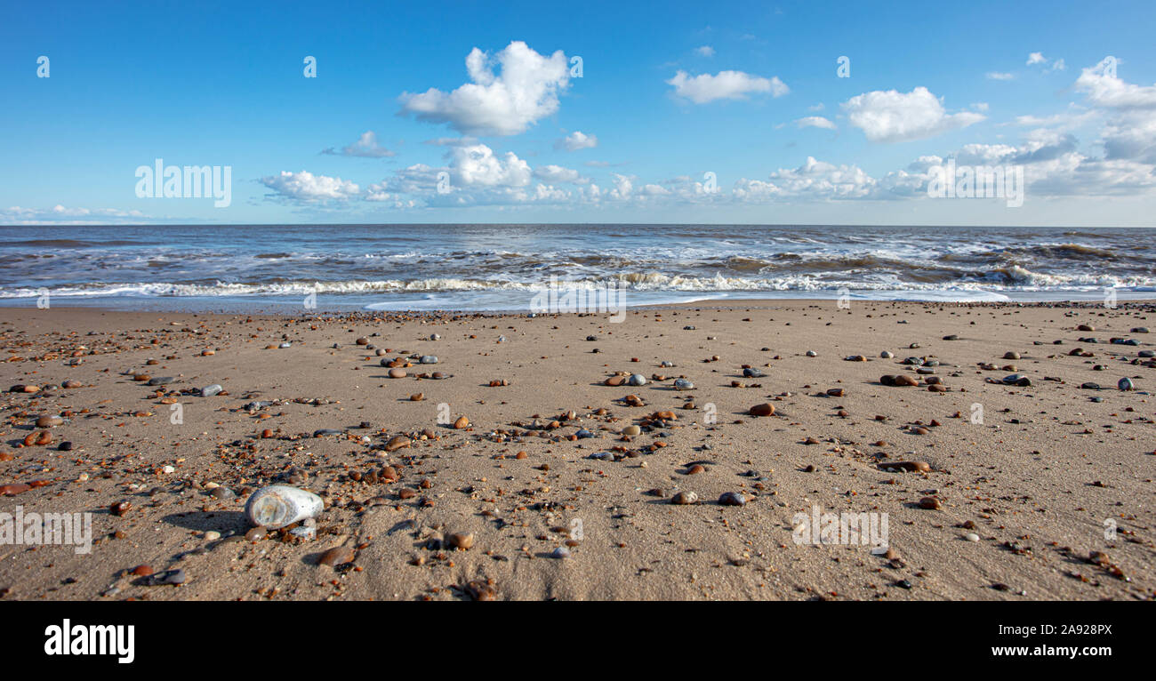 Blue sky with clouds over beach hi-res stock photography and images - Alamy