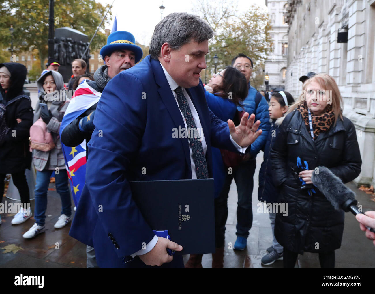 Housing Minister Kit Malthouse arriving at the Cabinet Office in London, ahead of a meeting of the Government's emergency committee Cobra, chaired by Prime Minister Boris Johnson in Downing Street, to discuss the response to recent flooding in the North of England. Stock Photo