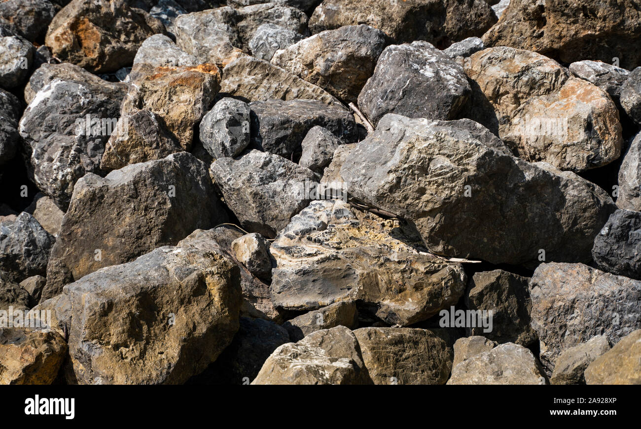 Big rocks on a beach in a sunlight Stock Photo - Alamy