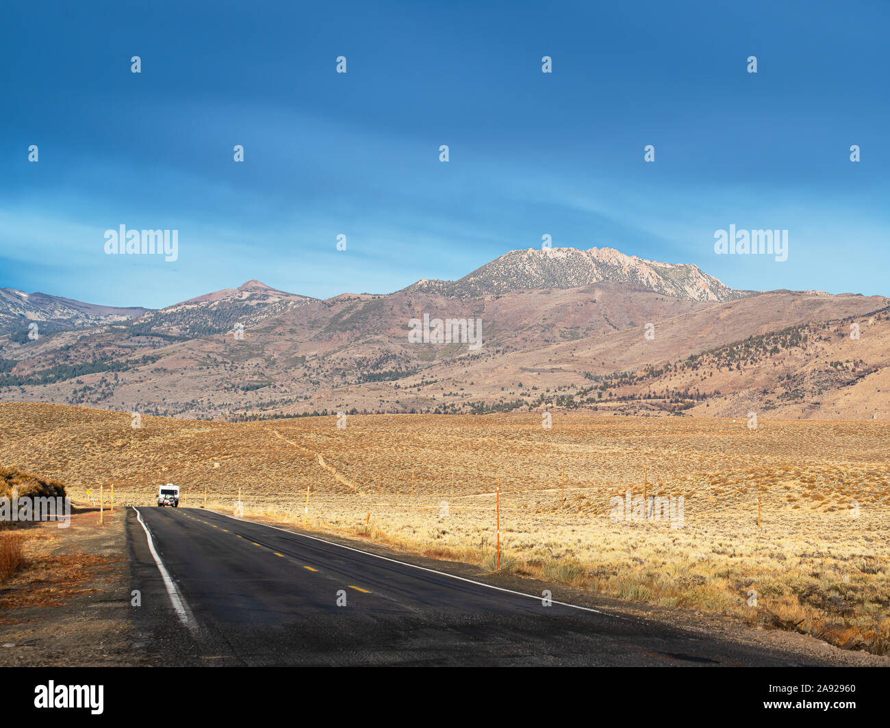 Recreational Vehicle traveling down a road in the California Eastern Sierra Mountains. Stock Photo