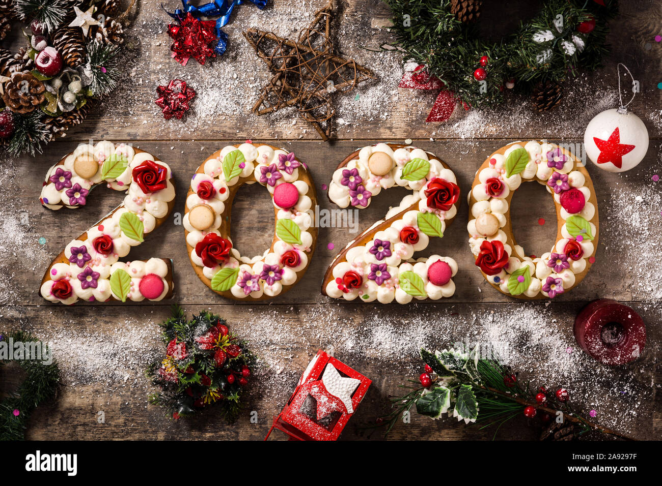 2020 Cake And Christmas Ornaments On Wooden Table New Year