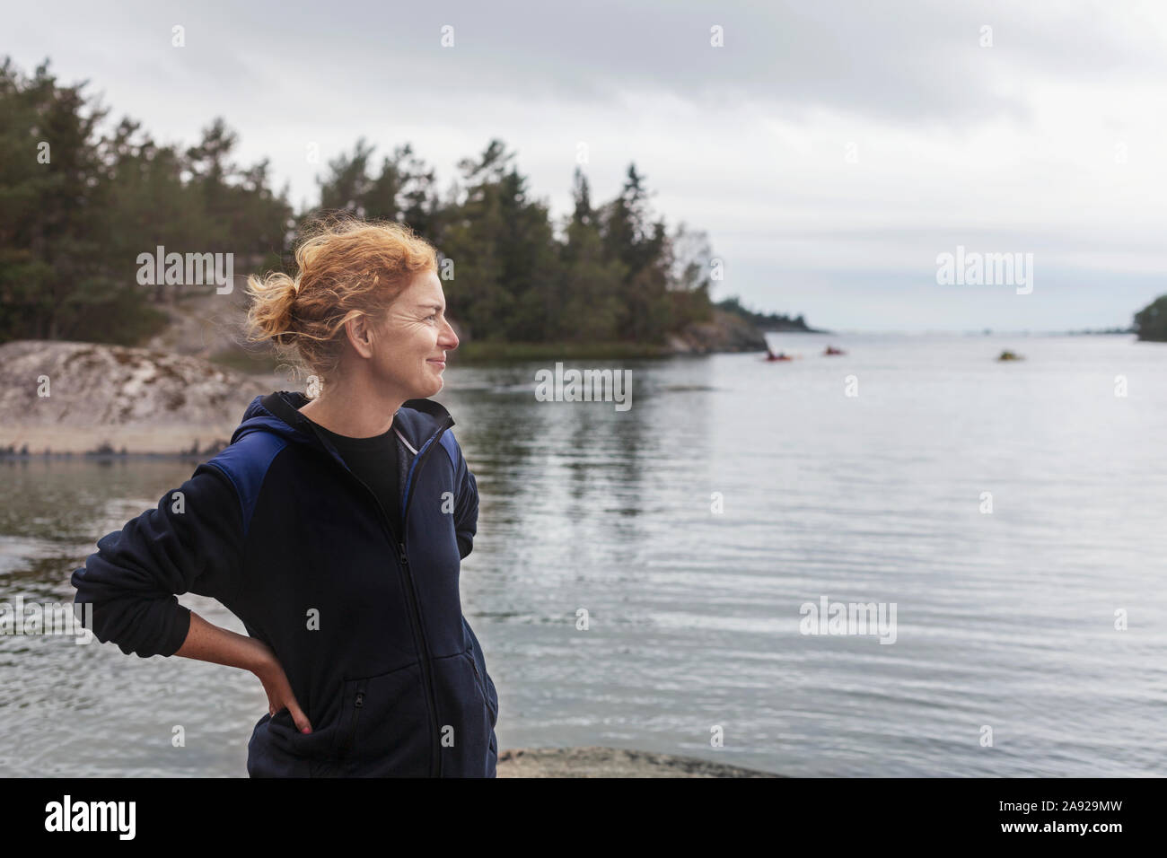 Woman by the ocean Stock Photo