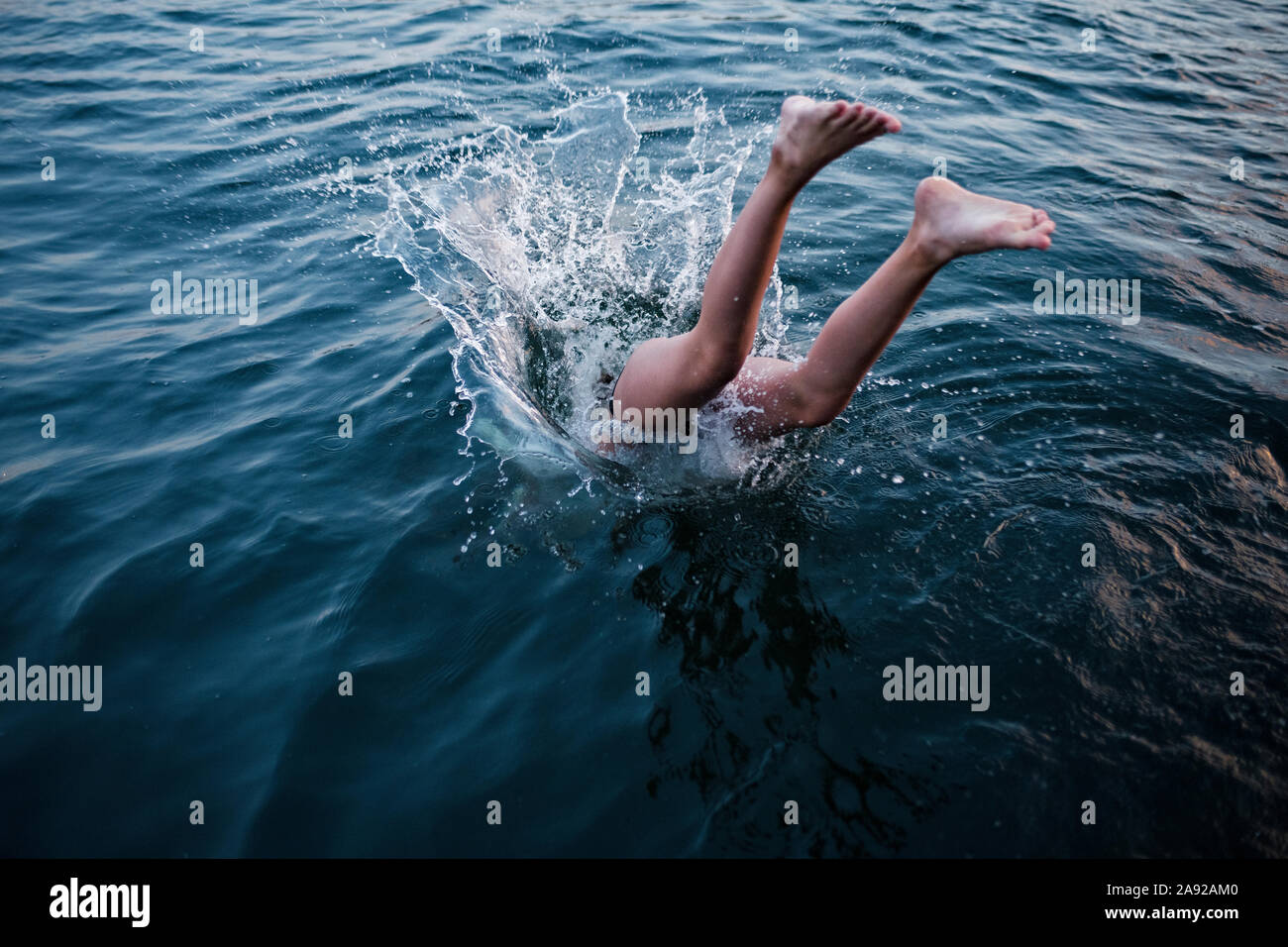 Jumping into water Stock Photo Alamy