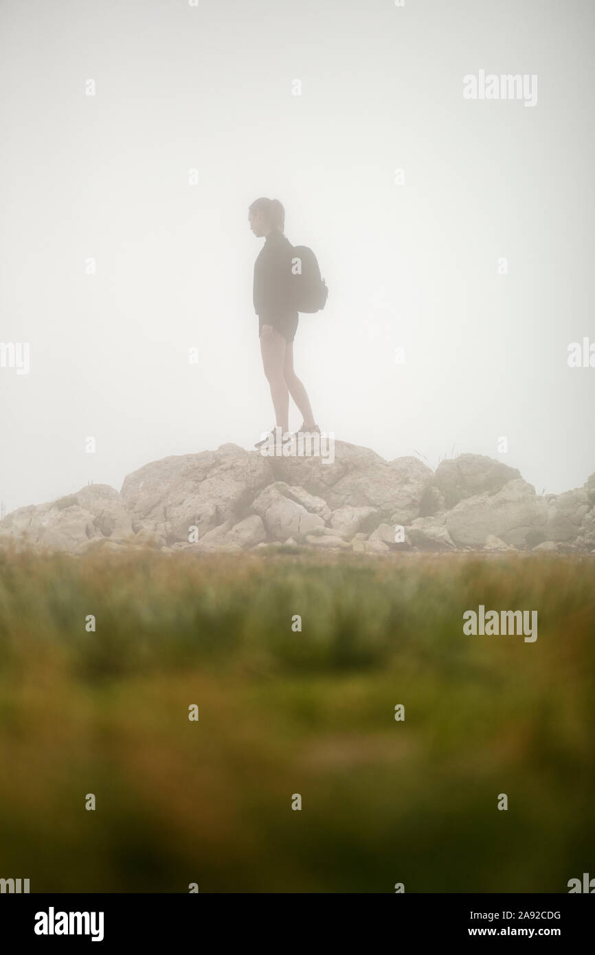 Girl in foggy weather Stock Photo