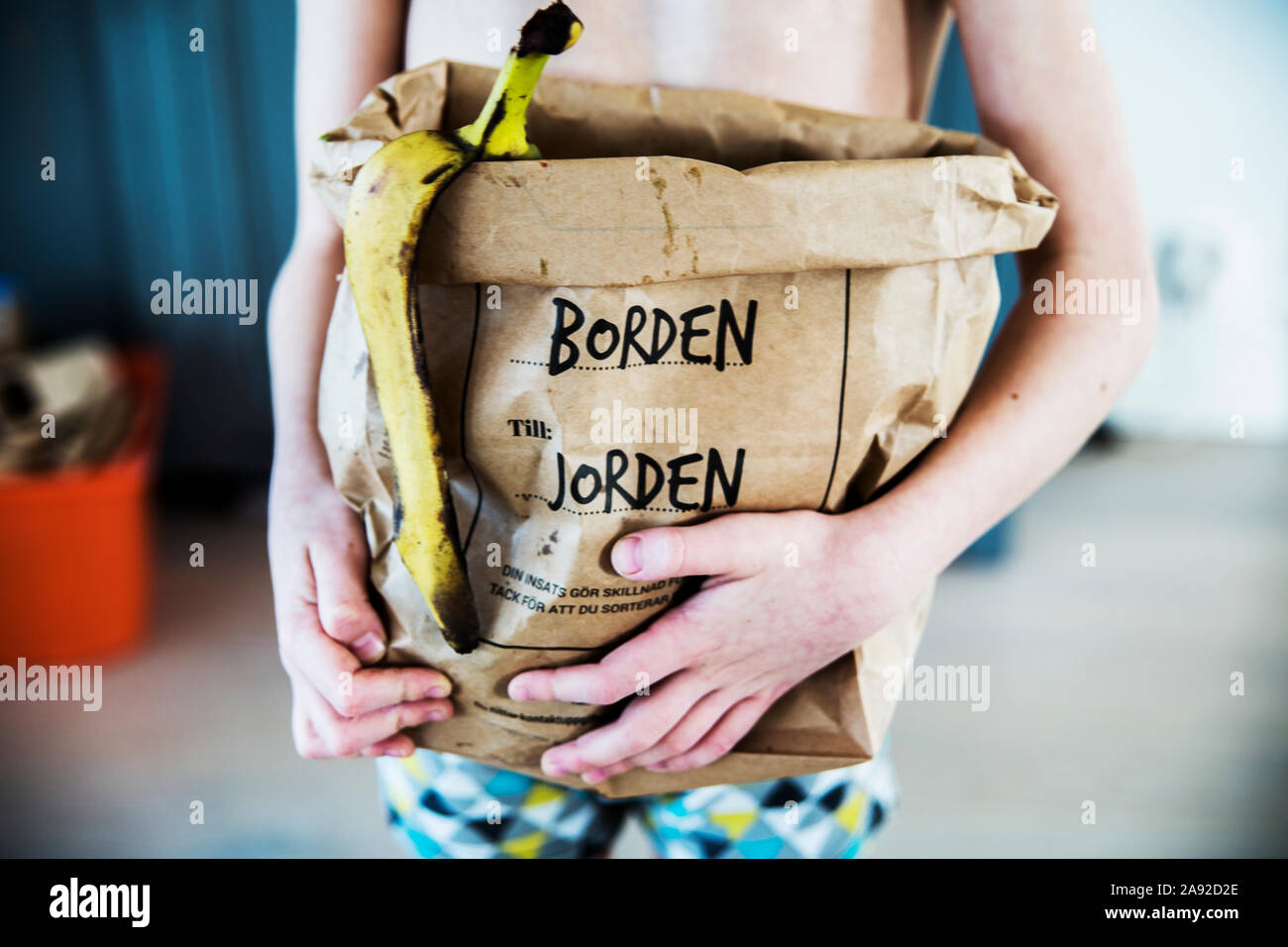Person holding bag with food waste Stock Photo