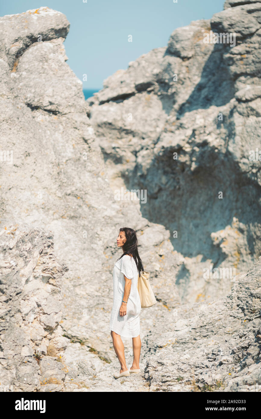 Woman on rocks Stock Photo