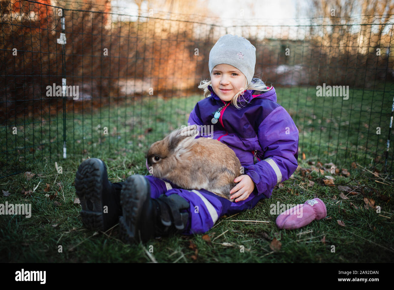Girl with rabbit Stock Photo - Alamy