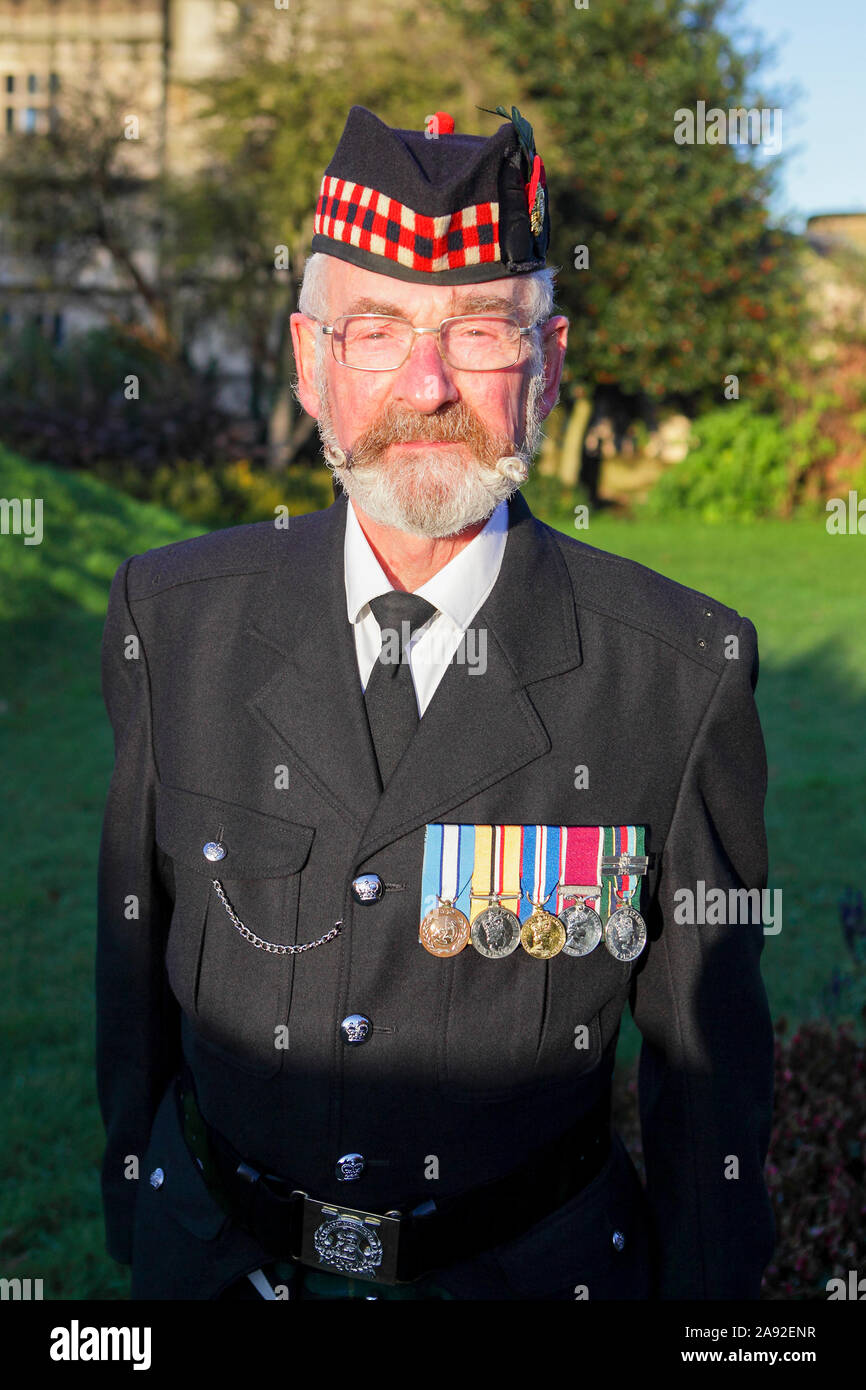 Remembrance Sunday commemorations on a beautiful Sunday at Shrewsbury Castle. A retired soldier poses for the camera. Stock Photo
