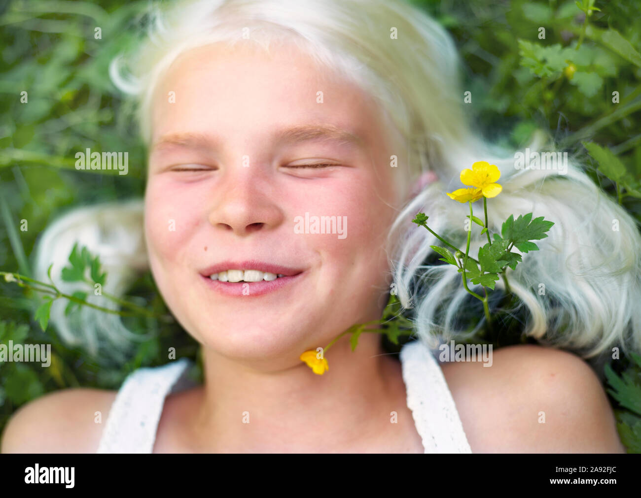 Smiling girl with eyes closed Stock Photo - Alamy