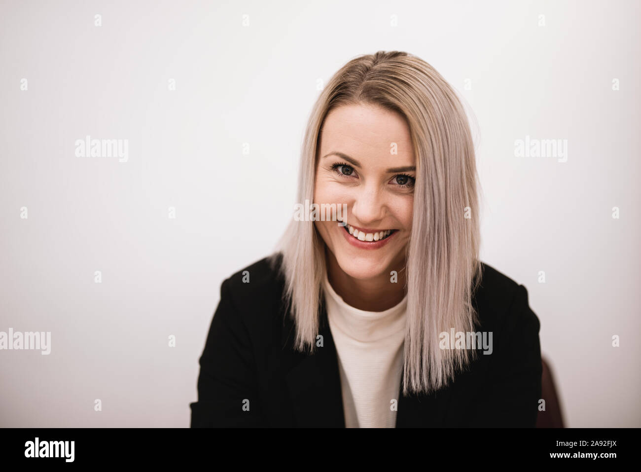 Happy blonde woman with copy hi-res stock photography and images - Alamy