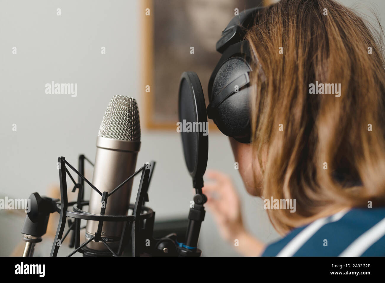 woman using headphones and microphone Stock Photo Alamy