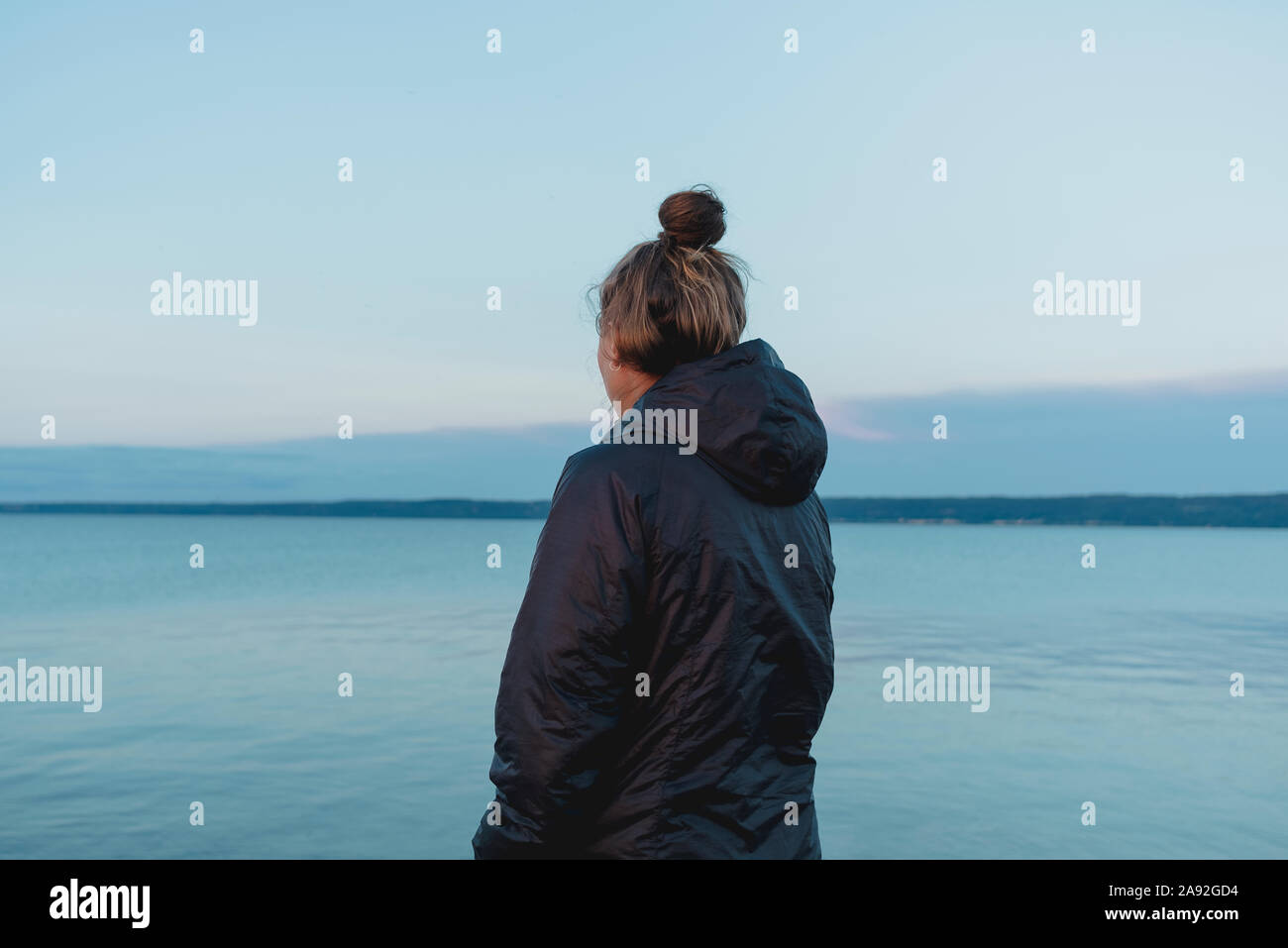 Woman looking at sea Stock Photo - Alamy