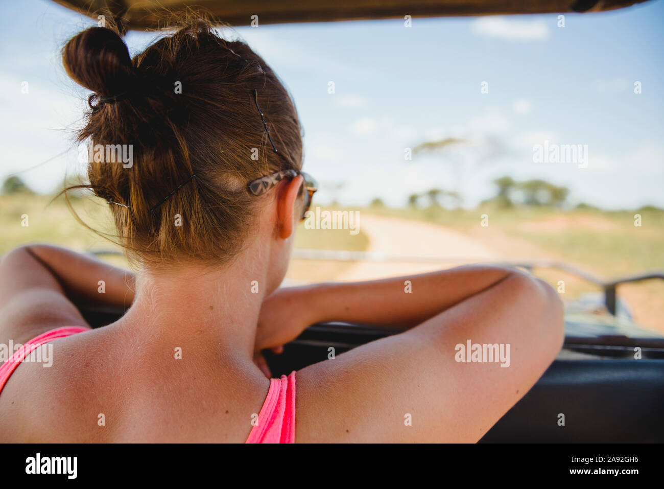 Woman in car looking at view Stock Photo