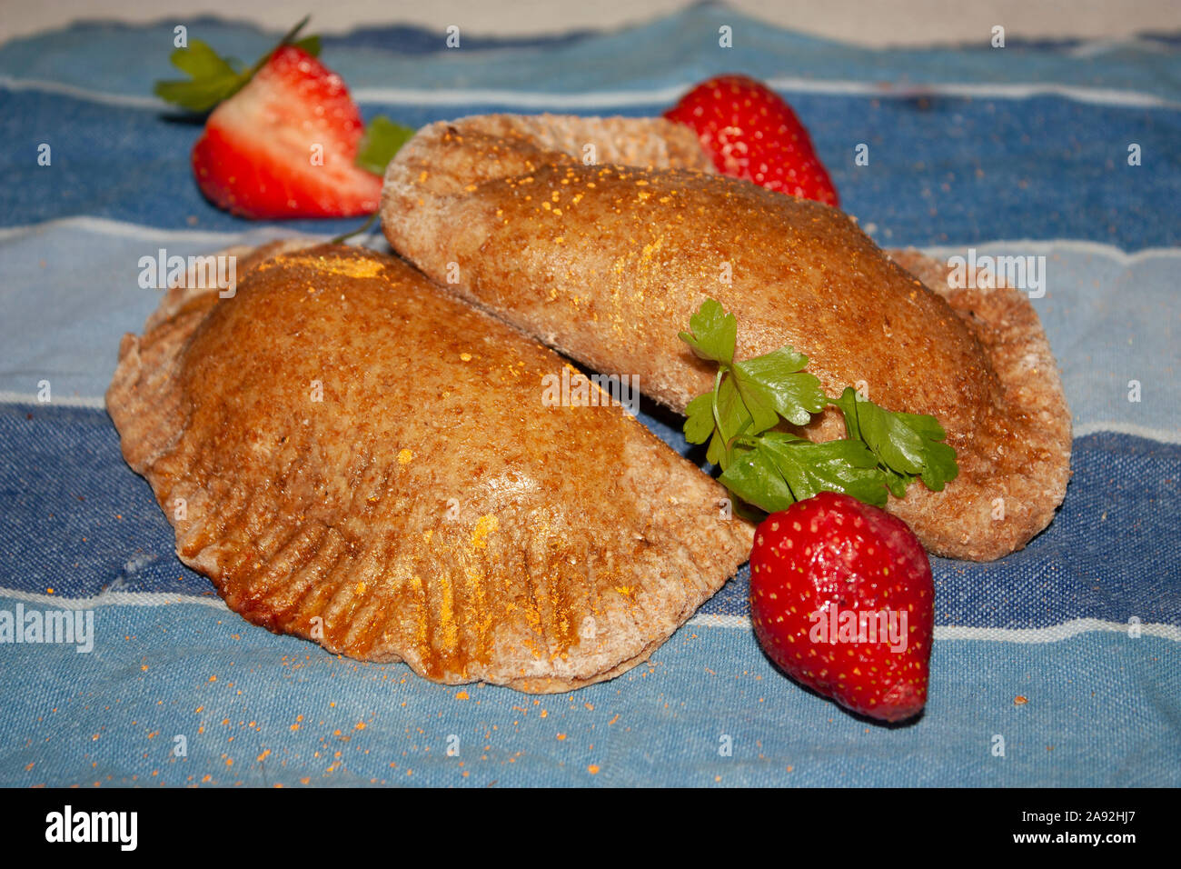 Fresh healthy wholemeal sweet empanadas stuffed with strawberry jam Stock Photo Alamy