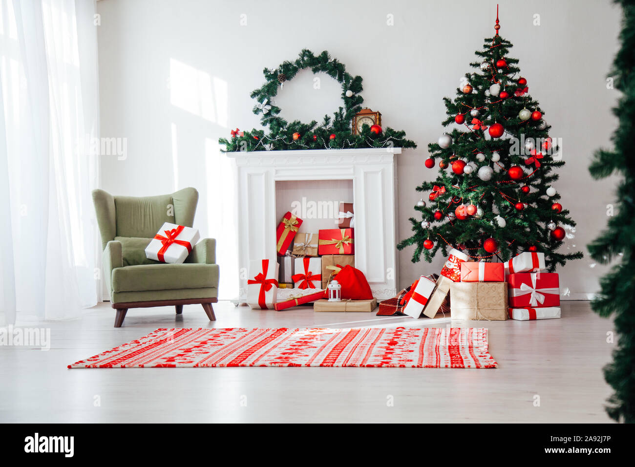 Christmas home interior Christmas tree red gifts new year decor festive  background Stock Photo - Alamy