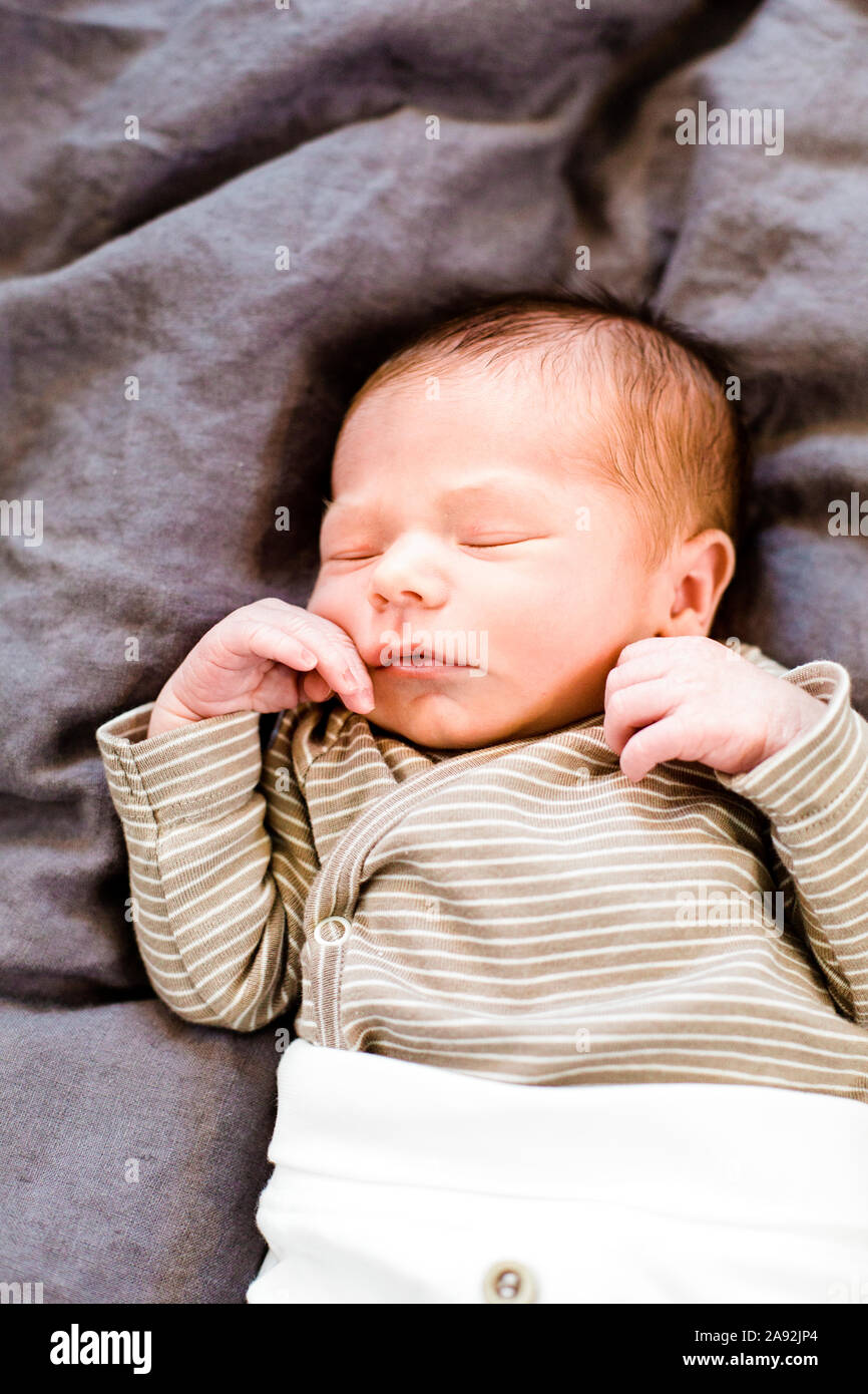 Baby eyes shut hires stock photography and images Alamy