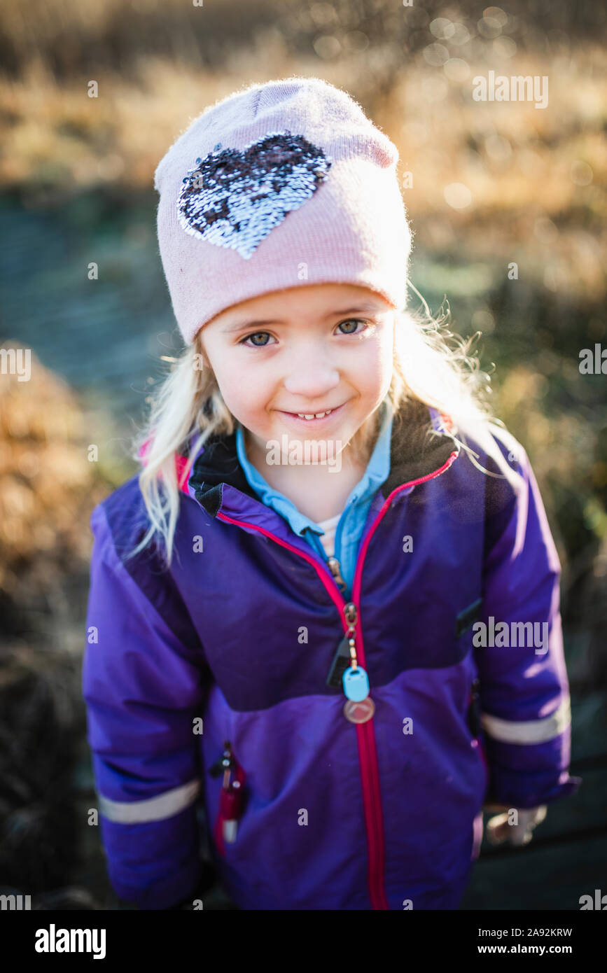 Smiling girl looking at camera Stock Photo - Alamy