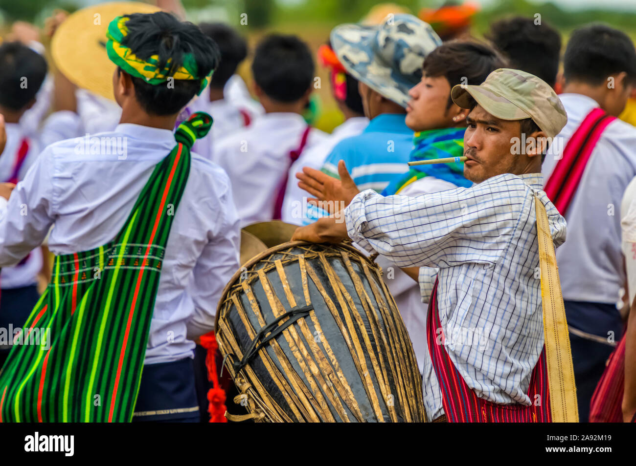 Burmese man playing the drum at a Pa'O festival; Yawngshwe, Shan State ...