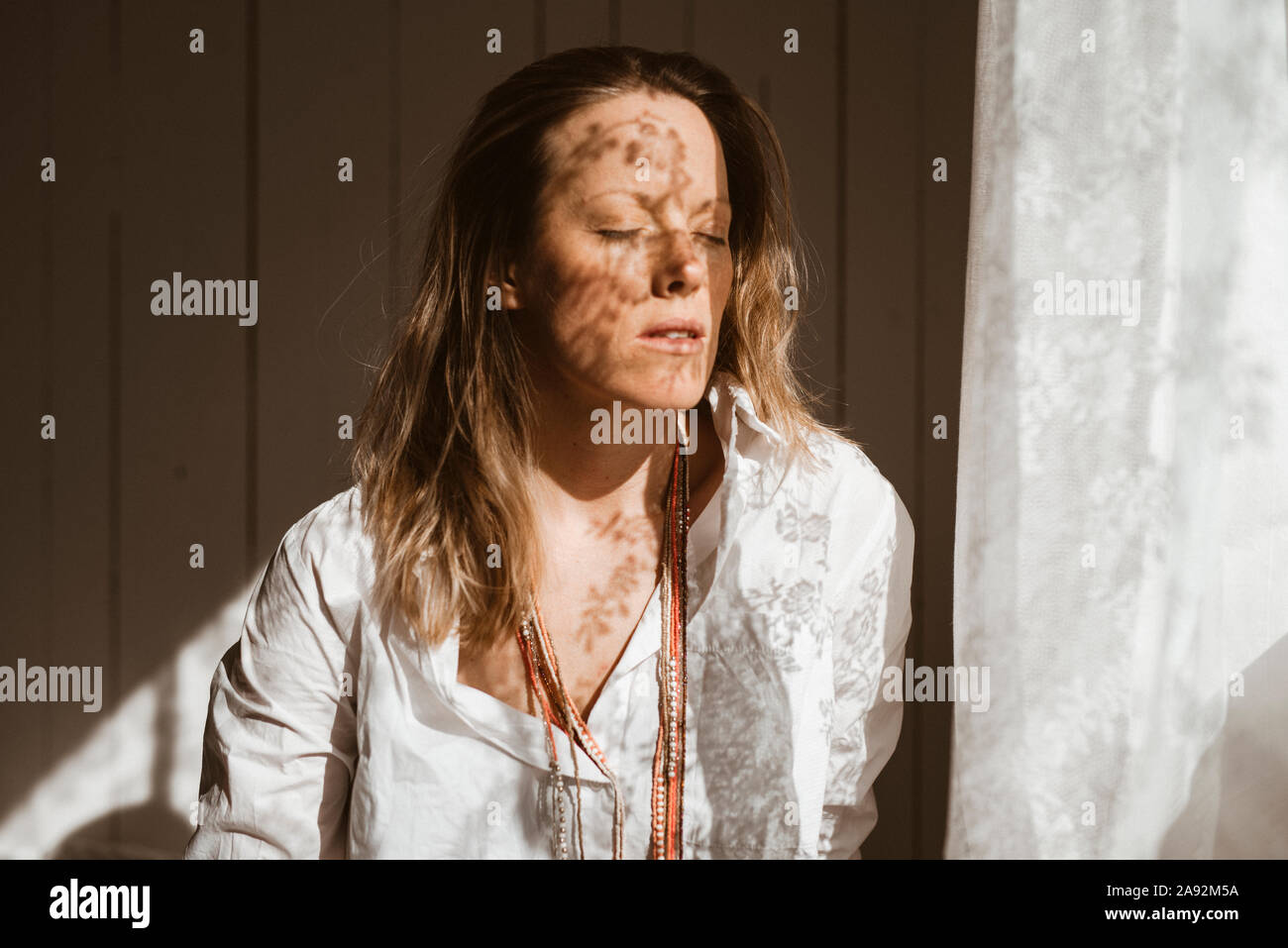 Woman with eyes closed Stock Photo