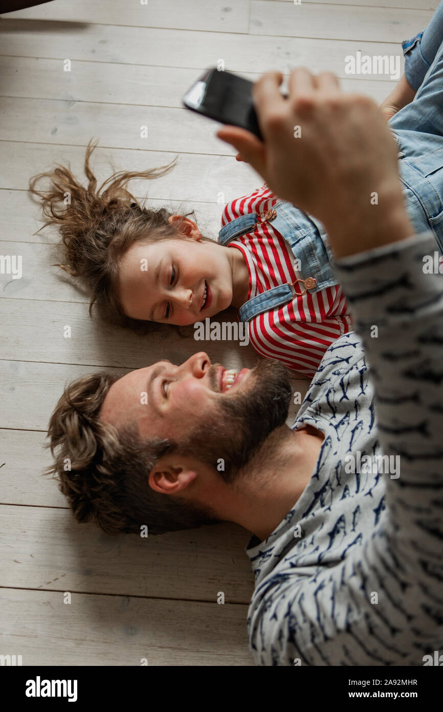 Father and daughter taking selfie Stock Photo