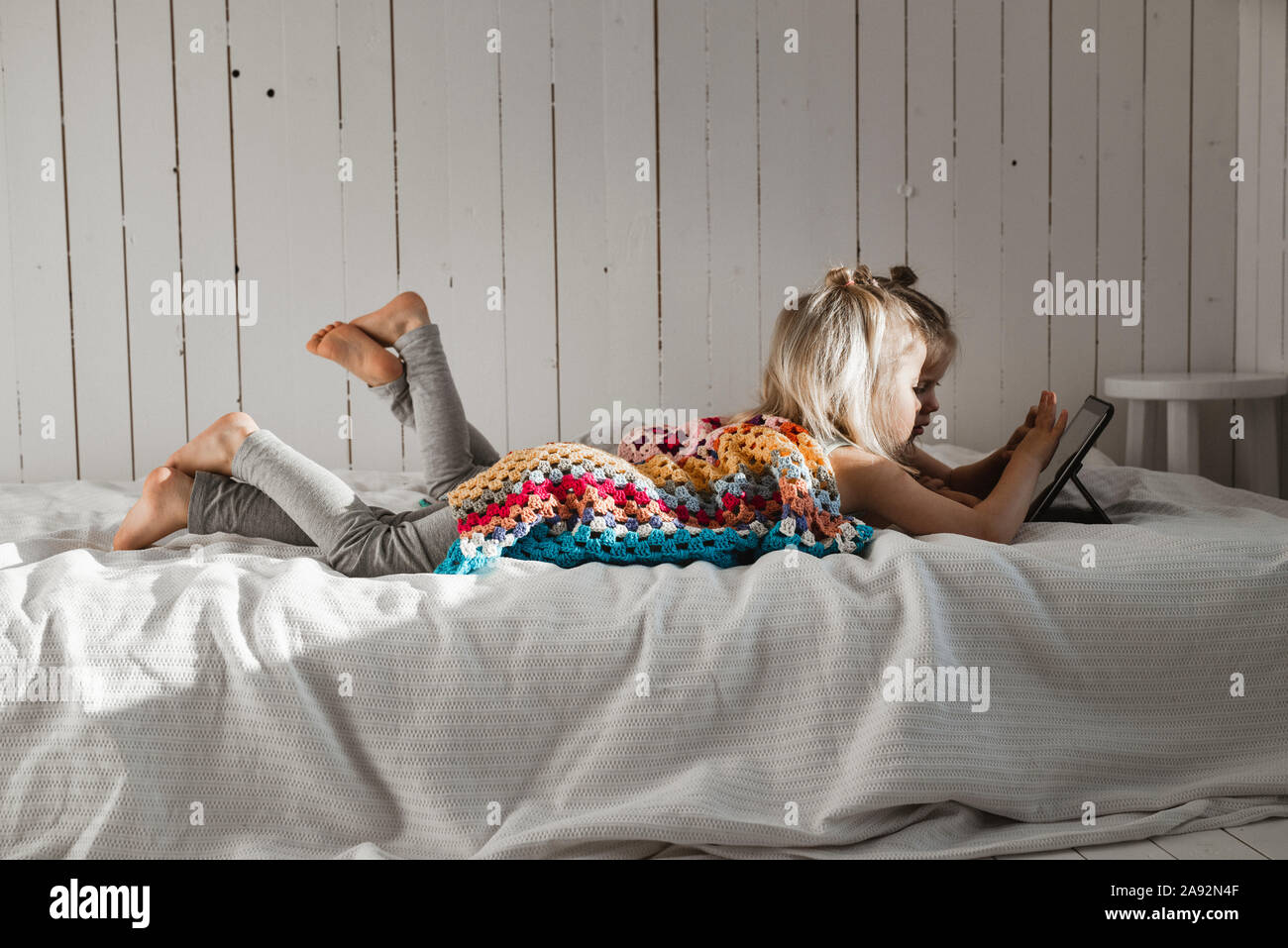 Girls using digital tablet Stock Photo
