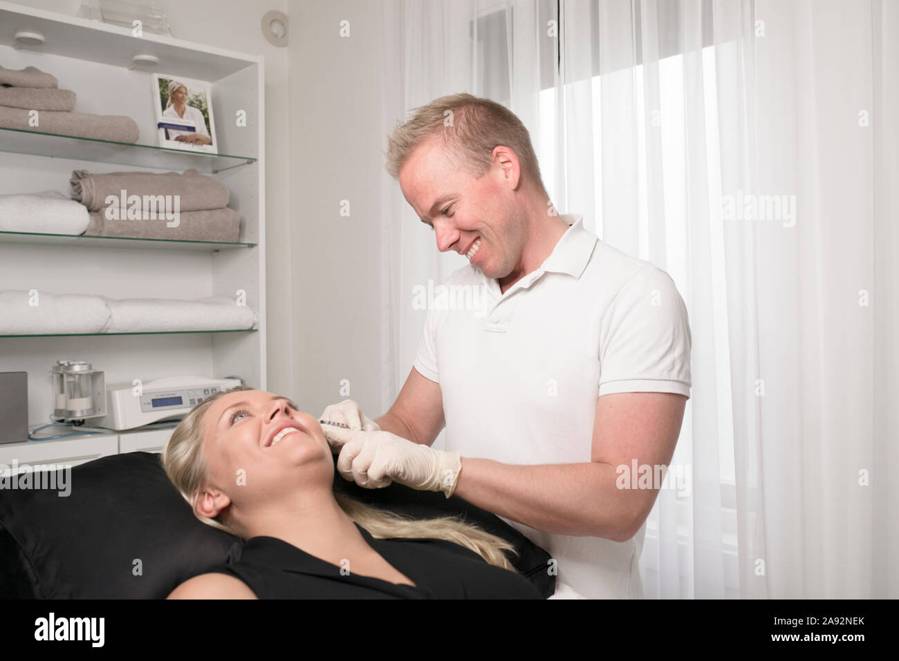 Woman receiving Botox injection Stock Photo