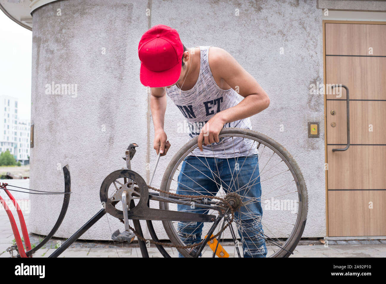 Man repairing bicycle Stock Photo Alamy
