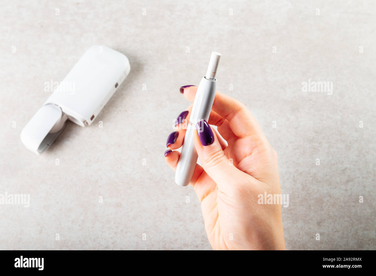 Heat not burn system for smoking, New trendy tobacco product technology  iqos, modern hybrid cigarette device Stock Photo