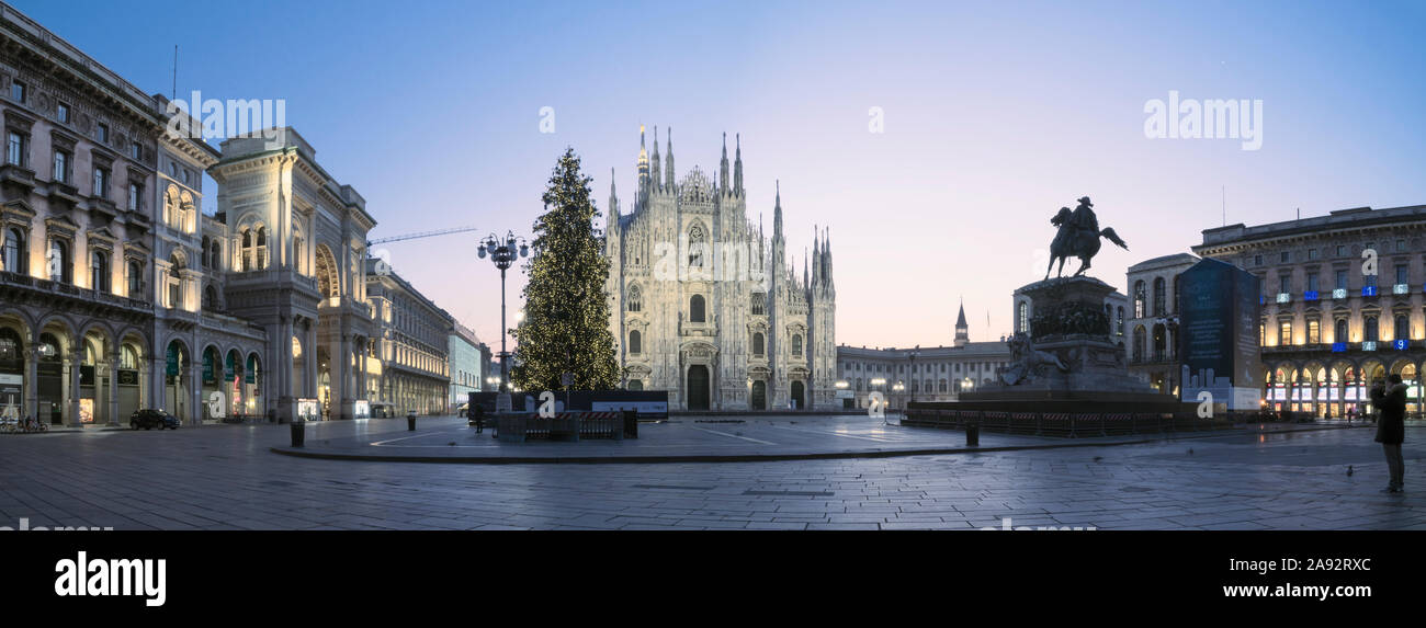 Milan, Italy - December 15, 2018: Duomo square in winter with Christmas tree at dawn. Stock Photo