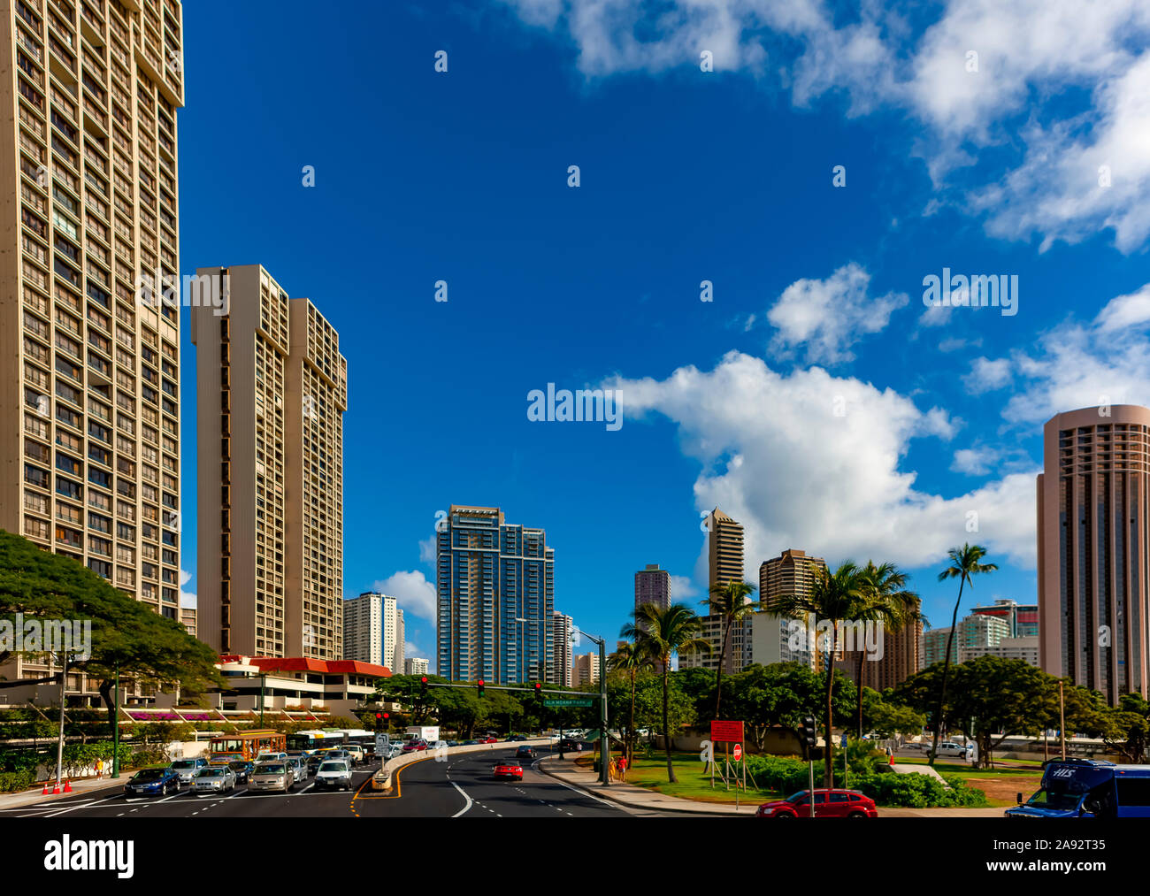 Busy roads in the tropical Hawaiian city of Honololu; Honolulu, Oahu, Hawaii, United States of America Stock Photo