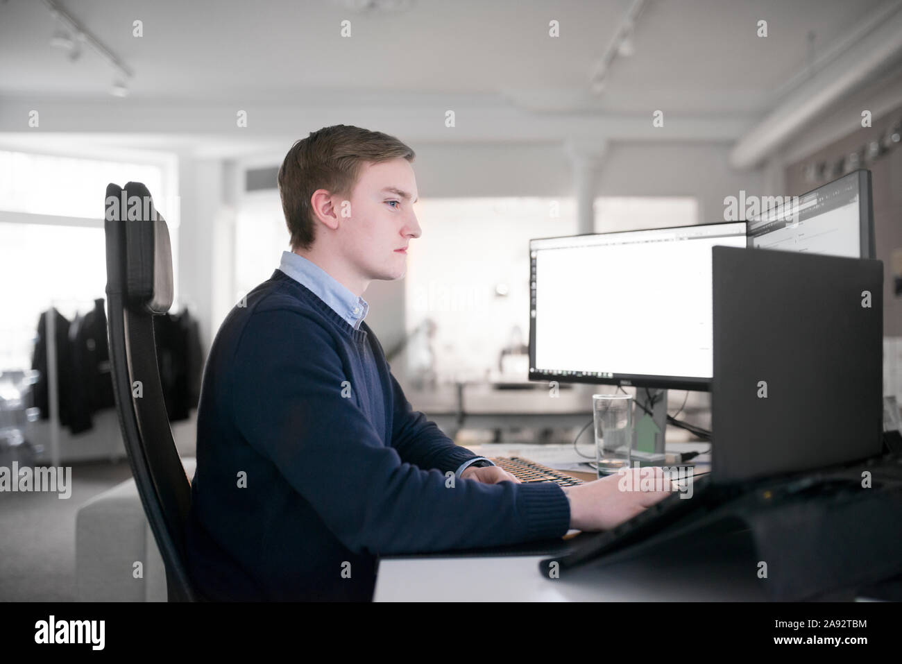 Young man working in office Stock Photo