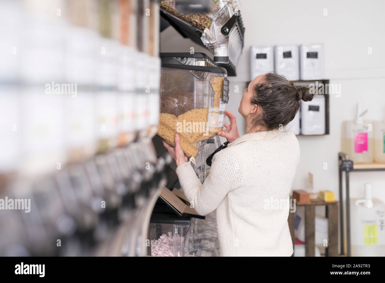 Woman working in shop Stock Photo