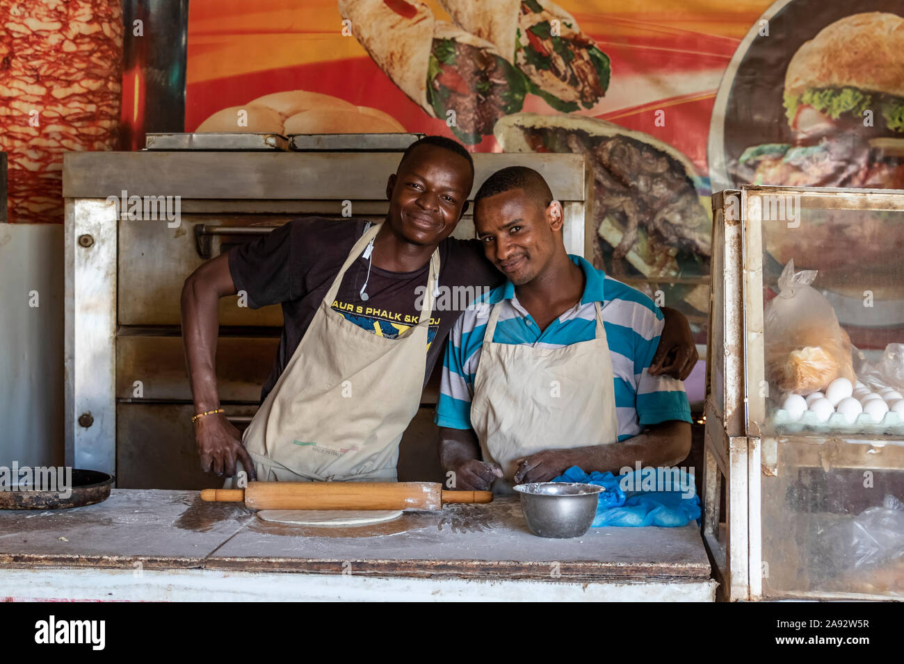 Cooks preparing a pizza; Ed Damer, Northern State, Sudan Stock Photo