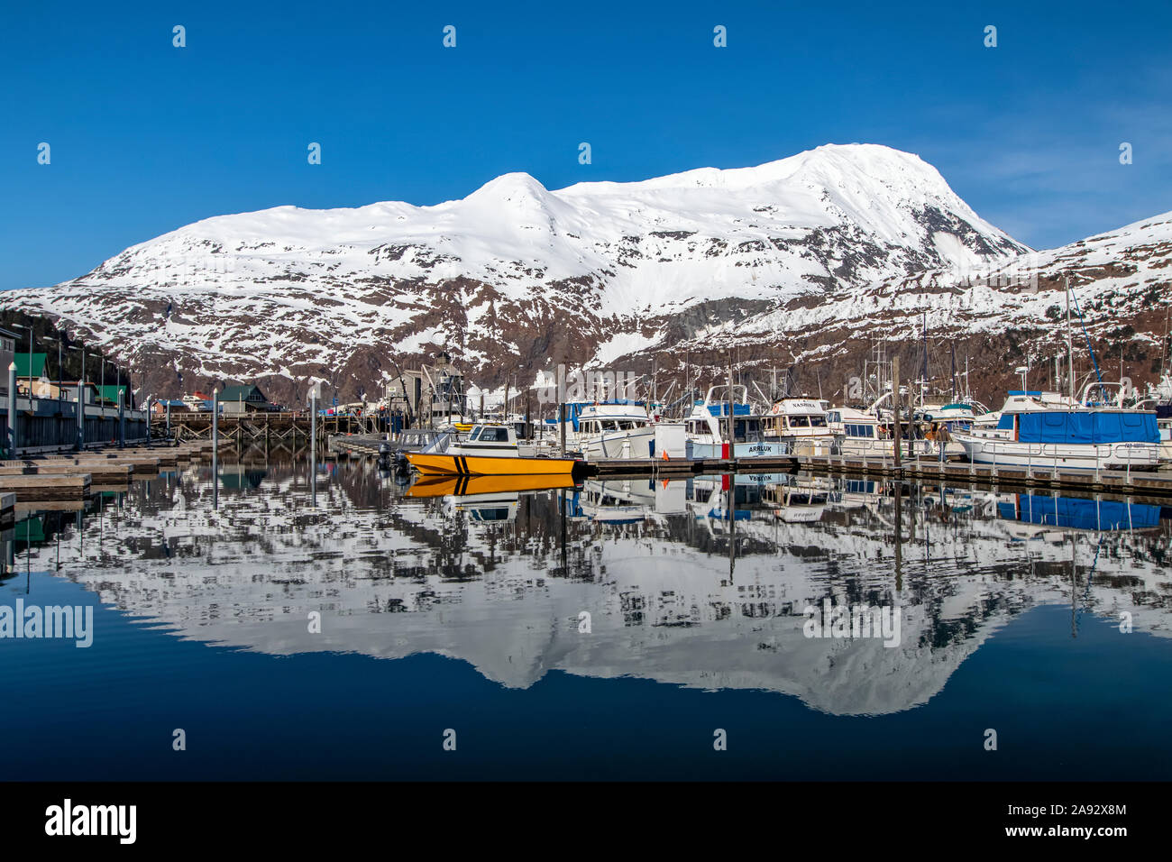 Small boat harbour with beautiful reflection in the water, South