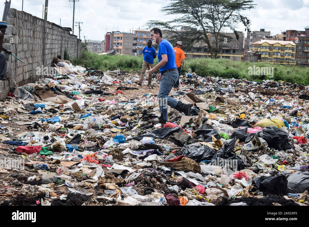 Nairobi, Kenya. 8th Nov, 2019. A participant walking in garbage during