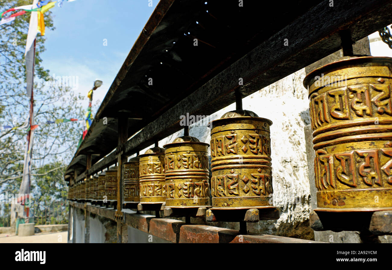 Prayer wheel at a temple in Nepal Om Mani Padme Hum Stock Photo