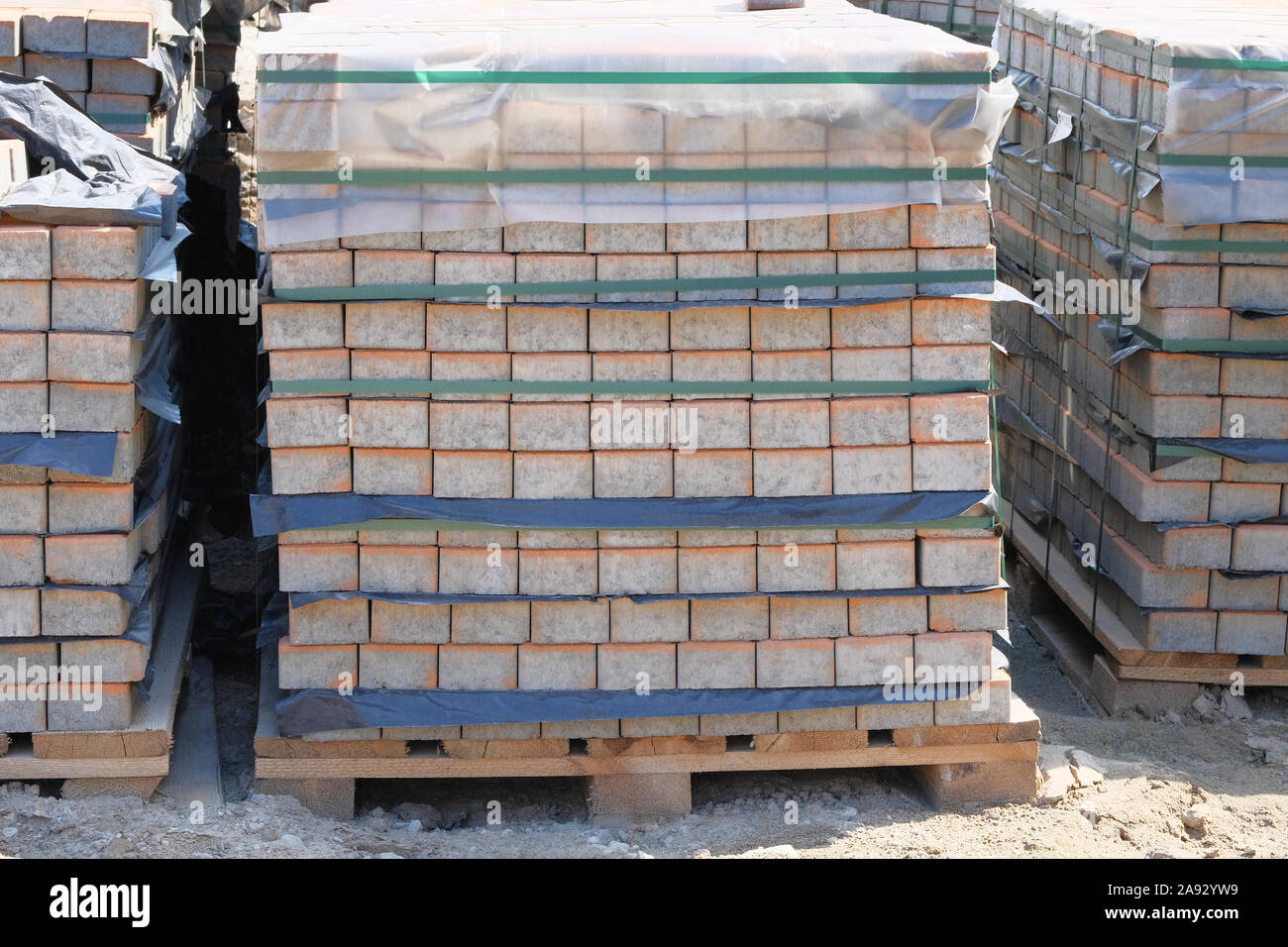 Construction Materials. Pile of gray bricks at construction site. Building materials for construction of buildings and structures. Stock Photo