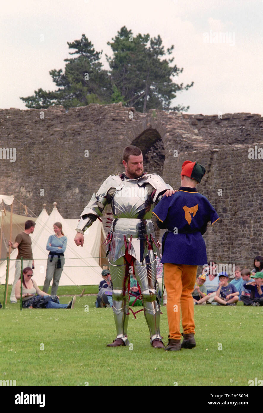 Medieval reenactment with a knight in armour Stock Photo