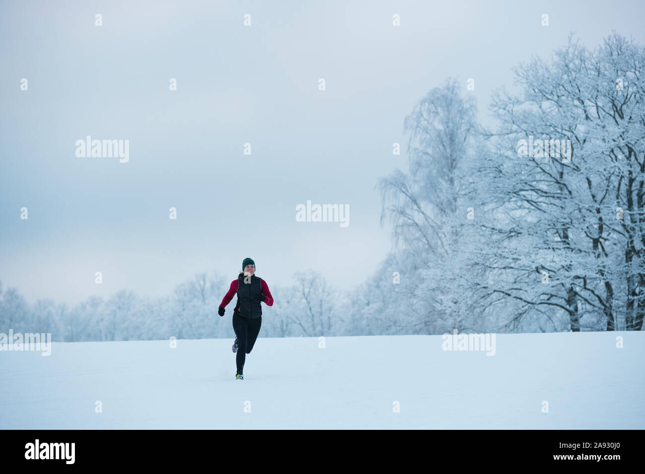 Woman jogging at winter Stock Photo