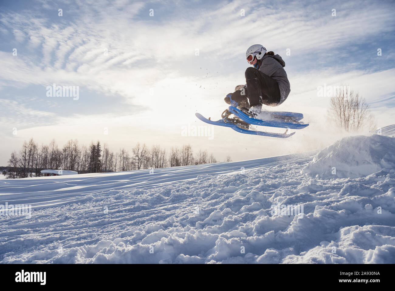 Boy on ski sledge Stock Photo