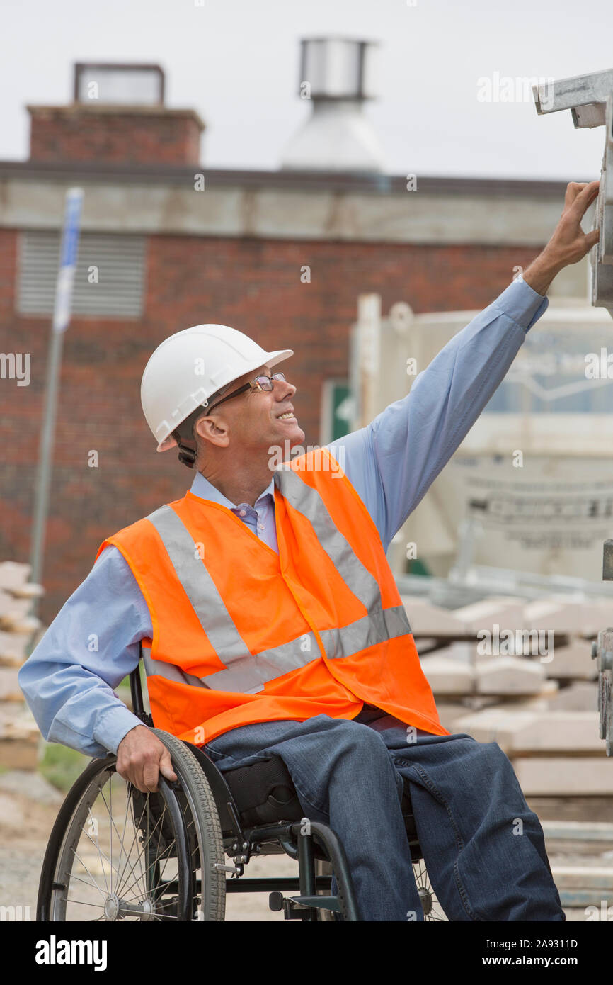 Project engineer with a Spinal Cord Injury in a wheelchair at job site