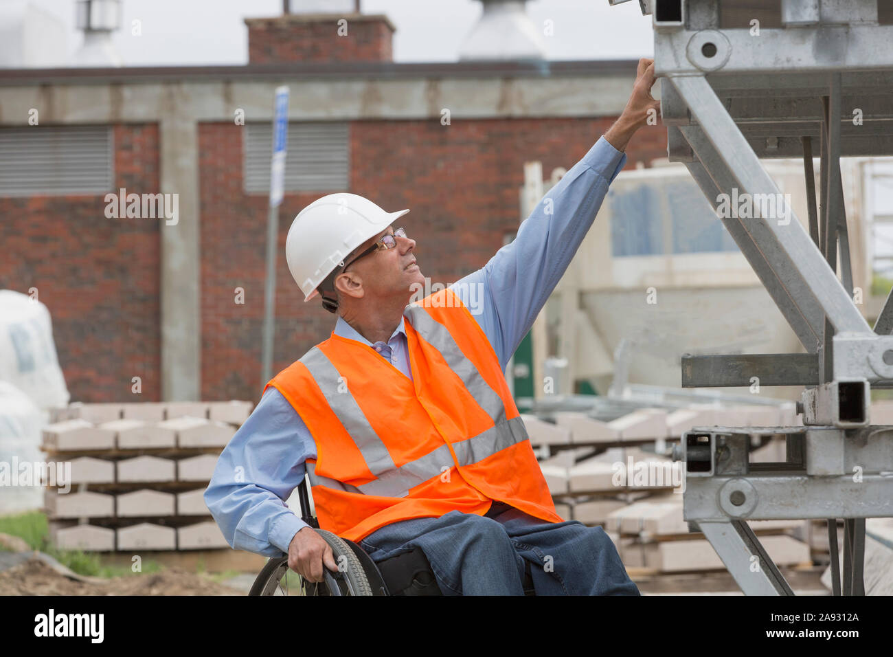 Project engineer with a Spinal Cord Injury in a wheelchair at job site