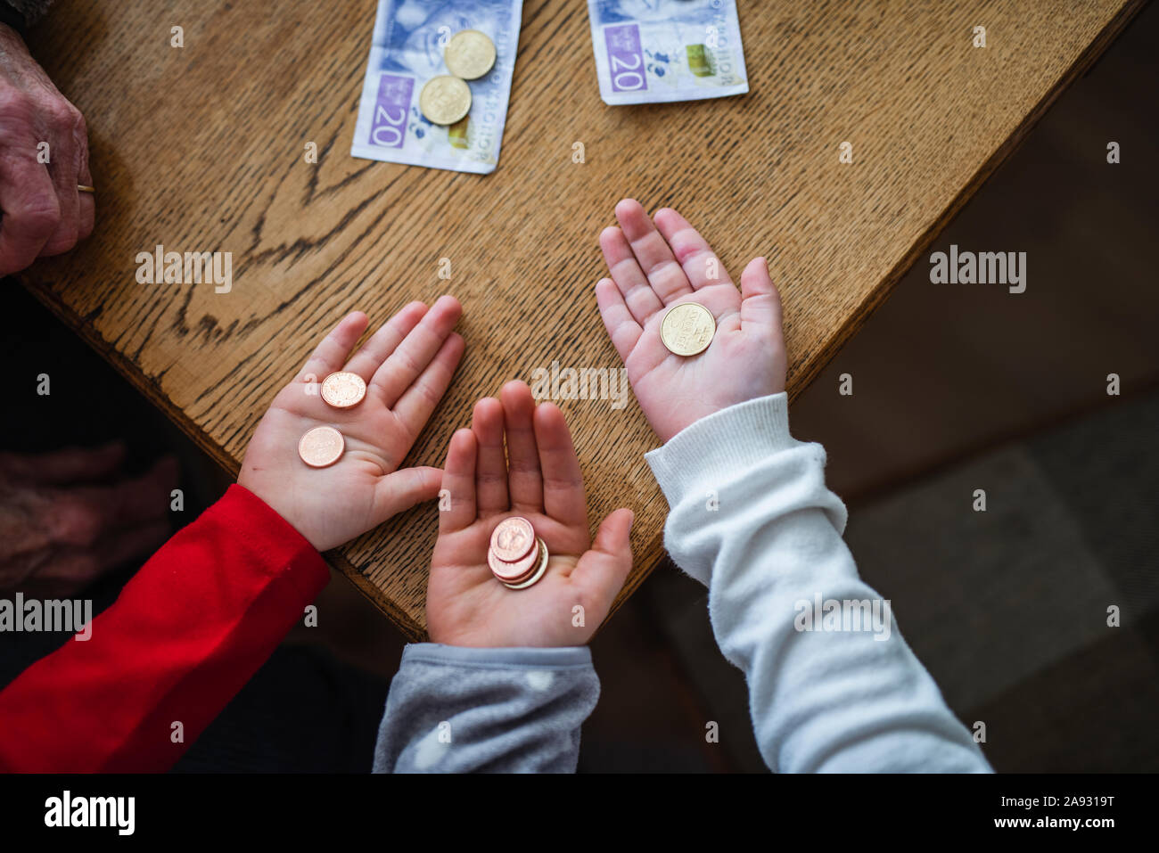 Hands holding coins Stock Photo