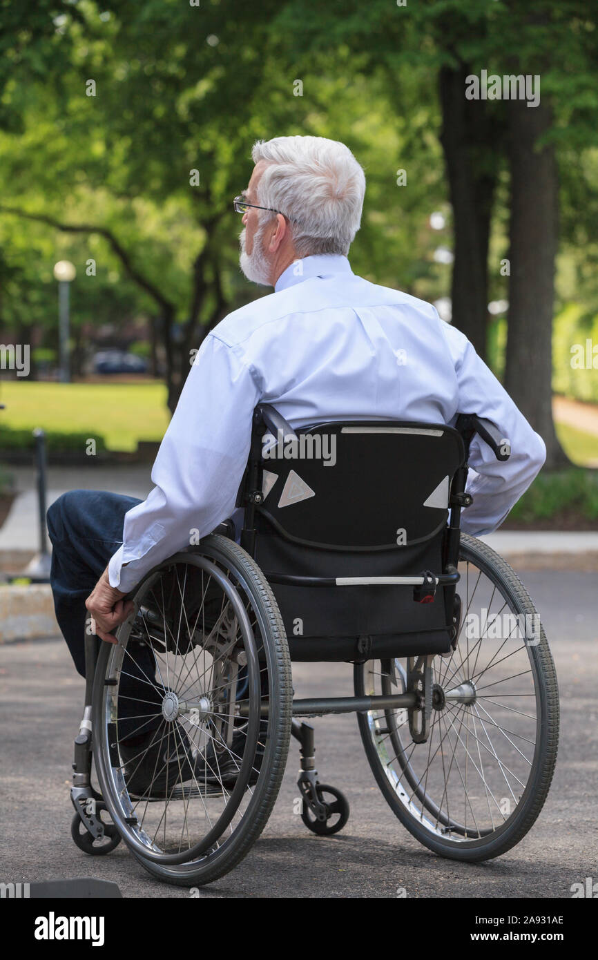 Businessman with Muscular Dystrophy in a wheelchair Stock Photo Alamy